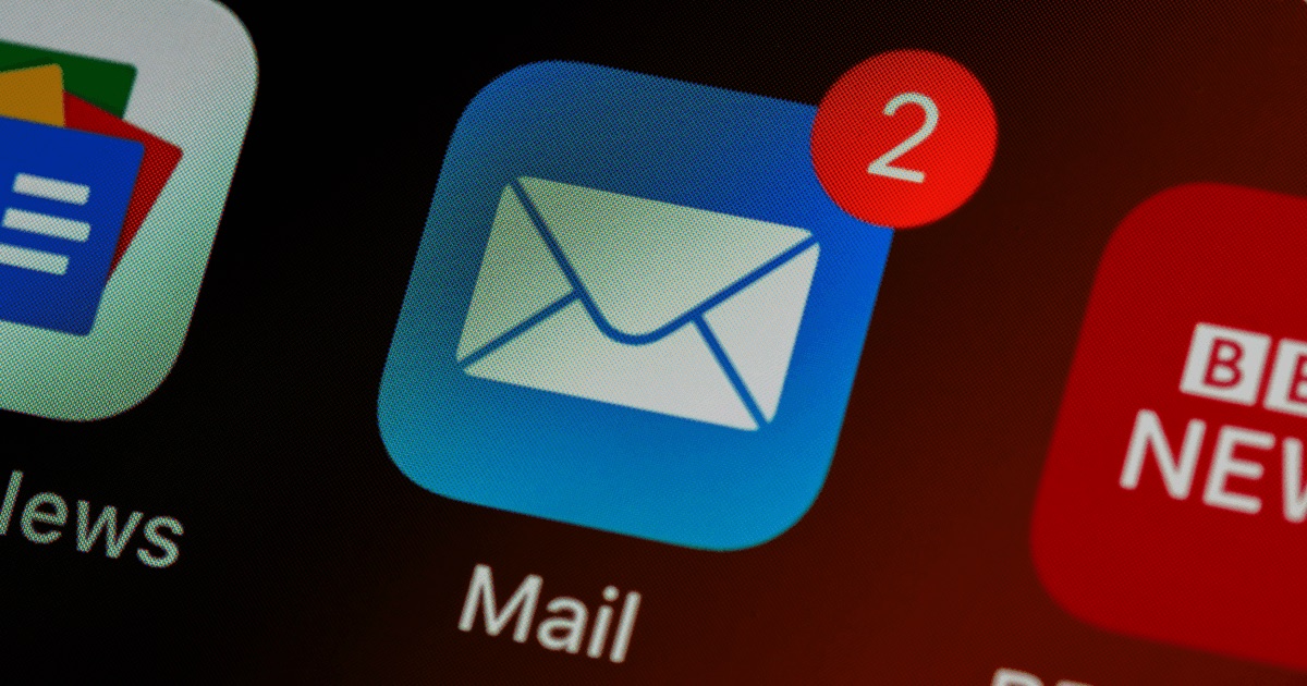 A phone screen showing the Mail app icon with two unread notifications
